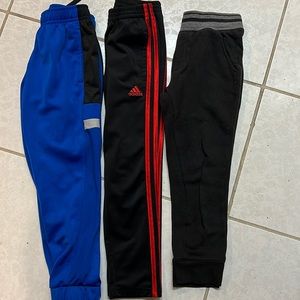 Boys size 6-7 warm up pants. Adidas - 1 pair and Athletic 2 pairs. 3 pair SOLD